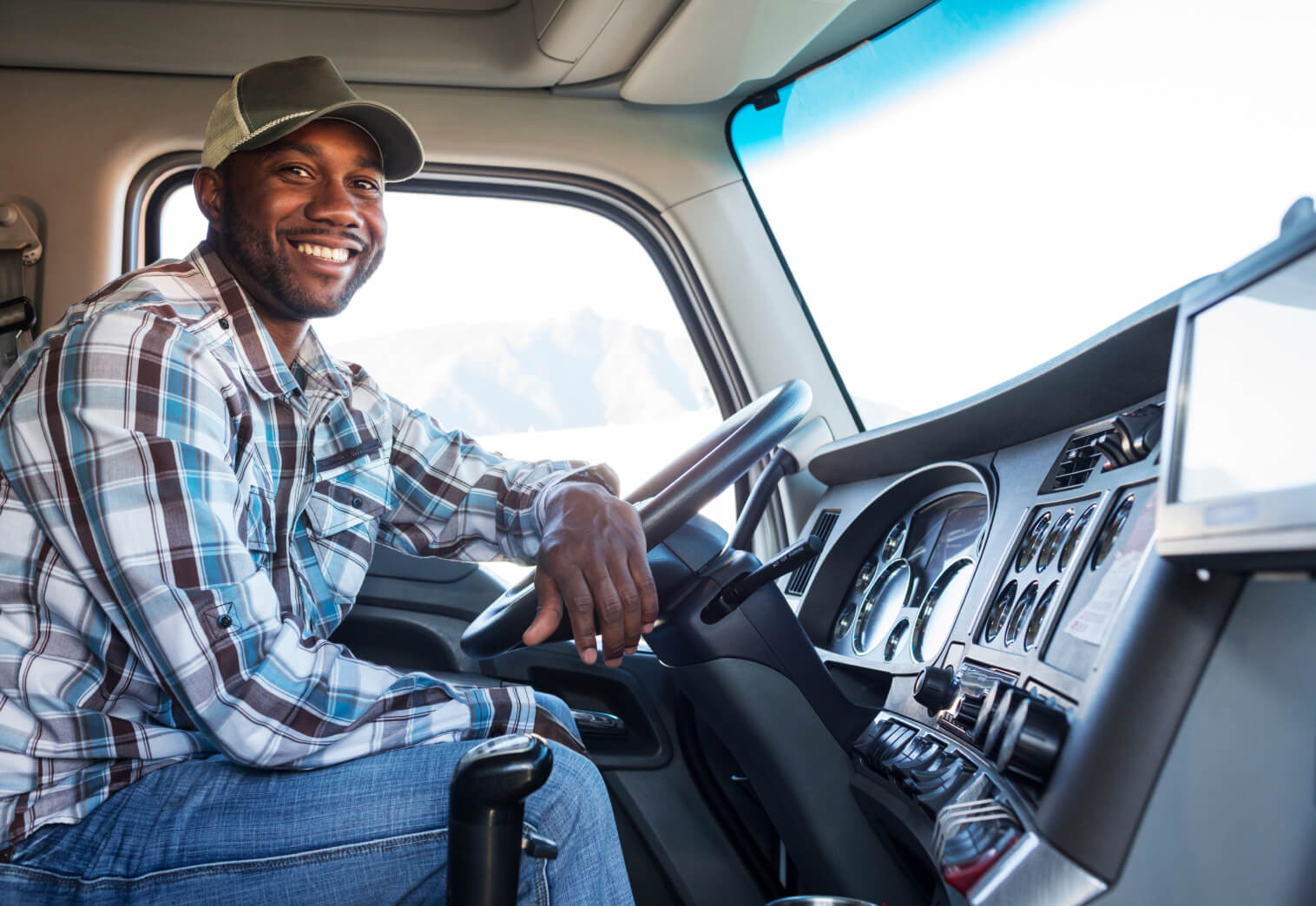 truck driver in cab of truck